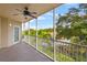 Spacious patio with serene views of tropical foliage and a community pool at 960 Starkey Rd # 5203, Largo, FL 33771