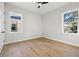 Bright bedroom with hardwood floors and two large windows at 125 48Th N Ave, St Petersburg, FL 33703