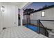 Deck overlooking the pool with patterned tile flooring at 125 48Th N Ave, St Petersburg, FL 33703