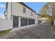 Three-car garage with dark gray doors and paver driveway at 125 48Th N Ave, St Petersburg, FL 33703