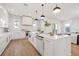 Modern kitchen with white cabinets, marble countertops, and gold hardware at 125 48Th N Ave, St Petersburg, FL 33703