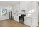 Modern kitchen with stainless steel appliances and white cabinetry at 125 48Th N Ave, St Petersburg, FL 33703