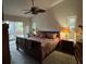 Main bedroom with king-size bed and sliding doors to patio at 4922 Lake Valencia W Blvd, Palm Harbor, FL 34684