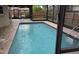 Inviting screened-in pool area with brick patio at 4922 Lake Valencia W Blvd, Palm Harbor, FL 34684