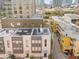 Aerial view showcasing the solar panels on the townhome's roof at 106 Fareham N Pl, St Petersburg, FL 33701