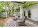 Private patio with stone flooring and lush greenery at 106 Fareham N Pl, St Petersburg, FL 33701