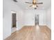 Spacious bedroom with hardwood floors and ceiling fan at 2511 N Grady Ave # 53, Tampa, FL 33607