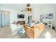 Living room features a leather couch, wood coffee table, and neutral decor at 957 Westwinds Blvd, Tarpon Springs, FL 34689