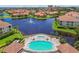 Aerial view of community pool and waterfront property at 18 Franklin S Ct # A, St Petersburg, FL 33711