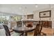 Open concept dining area with a dark wood table, overlooking the living room and kitchen at 18 Franklin S Ct # A, St Petersburg, FL 33711