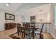 Formal dining room with wood table and chairs, and decorative rug at 18 Franklin S Ct # A, St Petersburg, FL 33711