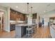 Modern kitchen with island, stainless steel appliances, and dark wood cabinets at 18 Franklin S Ct # A, St Petersburg, FL 33711