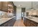 Modern kitchen with dark wood cabinets and stainless steel appliances at 18 Franklin S Ct # A, St Petersburg, FL 33711