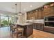 Modern kitchen with dark wood cabinets and a large island at 18 Franklin S Ct # A, St Petersburg, FL 33711