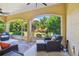 Relaxing screened porch with outdoor seating and lush landscaping at 18 Franklin S Ct # A, St Petersburg, FL 33711