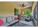 Covered porch with seating area and tropical views at 18 Franklin S Ct # A, St Petersburg, FL 33711