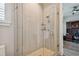 Walk-in shower with glass enclosure and tile surround at 18 Franklin S Ct # A, St Petersburg, FL 33711