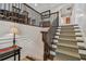 Elegant staircase with wood railings and neutral carpet at 18 Franklin S Ct # A, St Petersburg, FL 33711