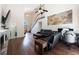 Living room with hardwood floors, high ceilings, and a view of the staircase at 2000 Brent Pl, Palm Harbor, FL 34683