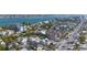 Expansive aerial view of a charming coastal neighborhood with homes, palm trees, and streets leading to the water at 108 14Th Ave # 3, St Pete Beach, FL 33706