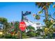 Street view featuring the corner of 14th Avenue and Pass-A-Grille Way, showcasing lush landscaping and neighborhood charm at 108 14Th Ave # 3, St Pete Beach, FL 33706