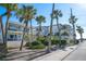 Multi-Gathering condo building with balconies, tropical landscaping, and convenient street access at 108 14Th Ave # 3, St Pete Beach, FL 33706