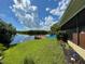 Large backyard with a dock and access to the water at 1964 Arvis E Cir, Clearwater, FL 33764