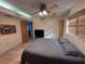 Comfortable bedroom with a large bed and ceiling fan at 1964 Arvis E Cir, Clearwater, FL 33764