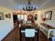 Bright dining room with a chandelier and views into the living room at 1964 Arvis E Cir, Clearwater, FL 33764