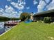 Backyard with dock access and paddleboard at 1964 Arvis E Cir, Clearwater, FL 33764