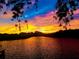 Stunning sunset over calm water with colorful sky at 1964 Arvis E Cir, Clearwater, FL 33764