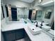 Modern bathroom with a double vanity and updated fixtures at 1964 Arvis E Cir, Clearwater, FL 33764