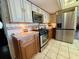 Spacious kitchen featuring stainless steel appliances and granite countertops at 1964 Arvis E Cir, Clearwater, FL 33764