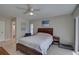 Bedroom with ceiling fan and access to bathroom at 2098 Swan Ln, Safety Harbor, FL 34695