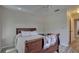 Bedroom with wooden sleigh bed, ceiling fan, and hardwood floors at 2098 Swan Ln, Safety Harbor, FL 34695