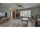 Living room with hardwood floors, large windows, and comfortable seating at 2098 Swan Ln, Safety Harbor, FL 34695