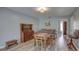 Living room with hardwood floors and view into dining area at 2098 Swan Ln, Safety Harbor, FL 34695