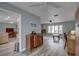 Light-filled living room with hardwood floors and views into kitchen at 2098 Swan Ln, Safety Harbor, FL 34695