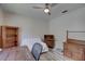 Home office with desk, chair, and wooden bookcase at 2098 Swan Ln, Safety Harbor, FL 34695