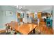 Dining room showcasing hardwood floors, bright lighting, and seamless access to the kitchen at 546 18Th Ne Ave, St Petersburg, FL 33704