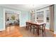 Light and airy dining room featuring hardwood floors, neutral paint, and decorative chandelier at 546 18Th Ne Ave, St Petersburg, FL 33704