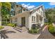 Charming home exterior featuring well-manicured landscaping, beautiful brick pavers, and classic architectural details at 546 18Th Ne Ave, St Petersburg, FL 33704