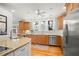 Kitchen area with stainless steel appliances, hardwood floors, and bright lighting at 546 18Th Ne Ave, St Petersburg, FL 33704