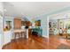 Kitchen area with bar and open floorplan into the living room at 546 18Th Ne Ave, St Petersburg, FL 33704