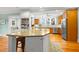 Kitchen area that features an island and breakfast bar with stainless steel appliances and hardwood flooring at 546 18Th Ne Ave, St Petersburg, FL 33704