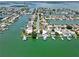 Wide aerial showcasing waterfront homes and community at 11600 7Th E St, Treasure Island, FL 33706