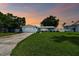 Charming home with well-maintained lawn and driveway at 11600 7Th E St, Treasure Island, FL 33706