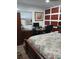 Primary bedroom with wood-look floors and wall decor at 1401 W Spencer St, Plant City, FL 33563
