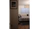 Guest bedroom with wood-look floors and window coverings at 1401 W Spencer St, Plant City, FL 33563