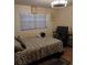 Bedroom with a large bed, and window coverings at 1401 W Spencer St, Plant City, FL 33563